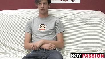 Adorable gay guy Danny jerks off his dick on couch solo