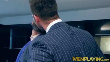 Elevator sex for a pair of businessmen in expensive suits