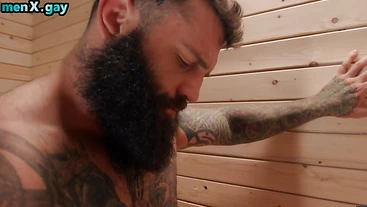 Bearded bear with inked body jock pouding BF in sauna
