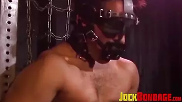 Man with muscles is restrained while only in his underwear